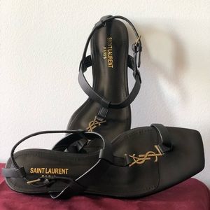 Leather YSL Cassandra flat sandals